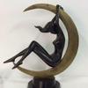 The top lot of the action was a bronze Art Deco statuette of a nude woman reclining inside a crescent moon, 23 by 20 by 9 inches, that went to a phone bidder for $1,905.