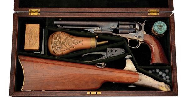 Colt 1860 fluted .44 caliber Army percussion revolver with detachable shoulder stock.  Gustave Young-style engraving.  Cased with accessories.  Estimate $17,000-$25,000