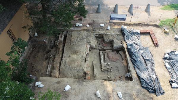 View of excavations showing the brick foundations for the 1856 church and the much smaller brick foundations for the first church building dating to the first quarter of the 19th century.