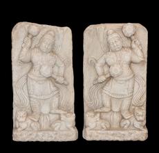 Chinese marble stelae, with high relief guardians clenching clubs and trampling beastly demons.  Lot 75, Gianguan Auctions, December 9, 2017 