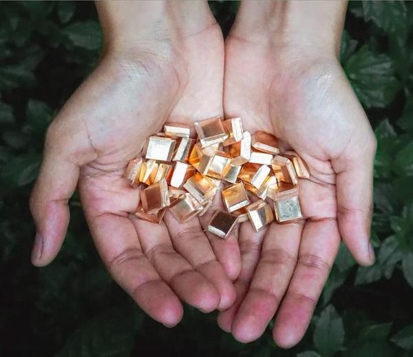 Cupped hands holding Impact Gold, a fully traceable gold artisanally mined in Peru by PX IMPACT® which created a sustainable, transparent supply chain that meets world leading standards for responsible practices through guaranteeing