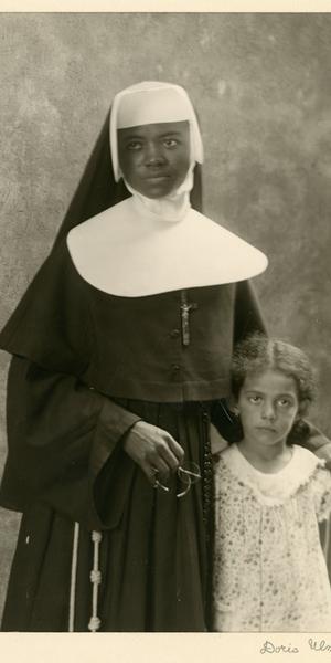 Doris Ulmann (American, 1882–1934), “Member of the Order of Sisters of the Holy Family and Child (Probably a Student), New Orleans, LA,” December 1931.  Posthumous gelatin silver print, printed by Samuel Lifshey, ca.  1934–37, 8 x 6 inches.  Berea College and the Doris Ulmann Foundation, 3406.