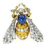 This 18kt gold, diamond and enamel "Bee" brooch, centered by an oval cabochon sapphire, will be sold Sunday, December 15th.