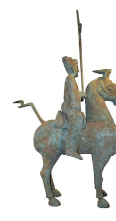 Massive archaic Chinese bronze statue of man on horseback.  Eastern Han Dynasty.