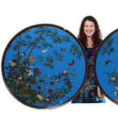 Massive pair of cloisonne chargers, each one 36 inches in diameter, featuring a beautiful blue background with colorful bamboo, floral, butterfly and bird motif.