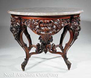 Lot 157, a rare, American Rococo carved and laminated rosewood center table attributed to John Henry Belter.  Made c.  1850-60, this table closely relates to the example Belter constructed for the Lincoln bedroom at the White House.  The center table more than doubled its pre-sale low estimate of $25,000, selling for $86,637.00.