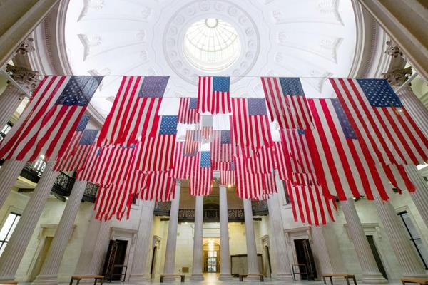 Exhibition view of A Living Thing: Flag Exchange, curated by Hesse McGraw, at Federal Hall, New York, 2017.  Photo: Guillaume Ziccarelli