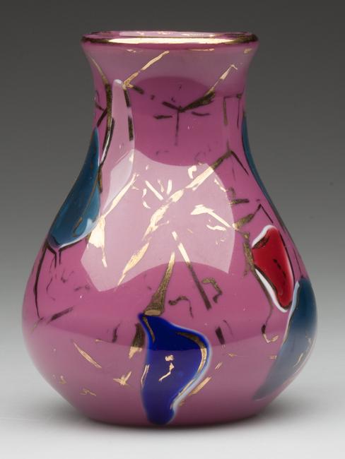 A bulbous-base vase done in shiny raspberry with multi-colored inclusions and gilt trim, circa 1878-80 realized the highest price of the day, $5,462.50.  [Lot 450]