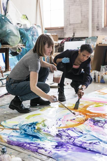 Kate Holcomb Hale (l) and Cicely Carew (r) working on a painting for "Is it Wednesday Yet?"