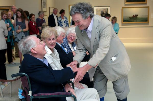 Artist Jamie Wyeth with Charles and Julie Cawley at an event in their honor.  