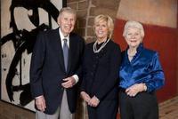 Harry W.  and Mary Margaret Anderson, and their daughter Mary Patricia Anderson Pence, standing in front of Franz Kline, Figure 8, 1952 and Mark Rothko, Pink and White over Red, 1957.  Both are works being donated to Stanford University.  