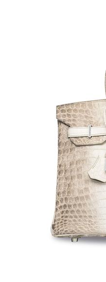 White crocodile Birkin bag from Hermes with gold and diamond hardware brought over $300,000 at Christie's Hong Kong.