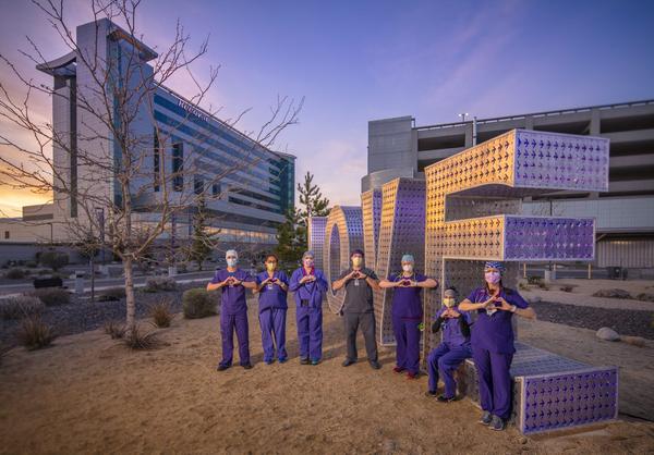 Renown Health Nurses in front of Kimpton's LOVE sculpture.  Photograph by David Siegel