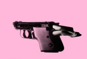 Laurie Simmons, Lying Gun/Pink, 2014.  Pigment Print, 20 5/8 x 30 inches.  Edition of 10, each in a unique color.  