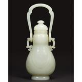 Chinese Pale Celadon Jade Covered Vase, 18th Century, Height overall 9 1/8 inches.  From the Estate of Baron Pierre DeMenasce.  Estimate $500,000-700,000.  