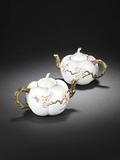 A rare pair of famille rose 'melon' teapots and covers, with iron-red Qianlong seal marks, sold for £1,341,600 at Bonhams.