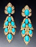 This extravagant pair of turquoise and diamond earrings are mounted in gold and signed by Van Cleef & Arpels is offered by Epoque Fine Jewels..  