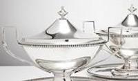 Pair of sterling silver sauce boats with stands and unusual squared handles, 1781.