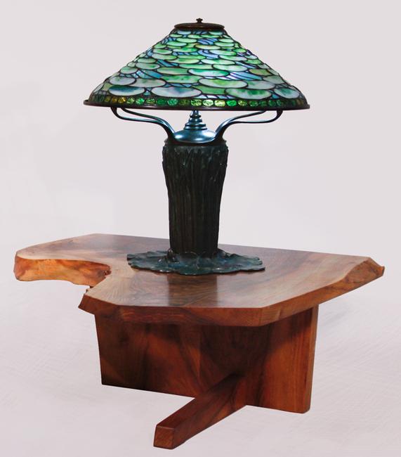 Tiffany Studios lily pad lamp on a George Nakashima low table