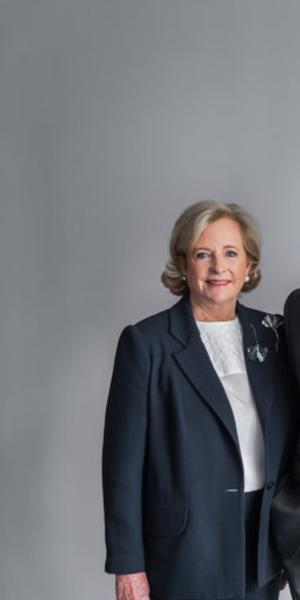 Patricia Phelps de Cisneros with Glenn D.  Lowry, Director of The Museum of Modern Art, next to a 1950 work by Alejandro Otero.