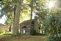 A 19th-century Ohio log cabin.  Estimate $4,000-6,000