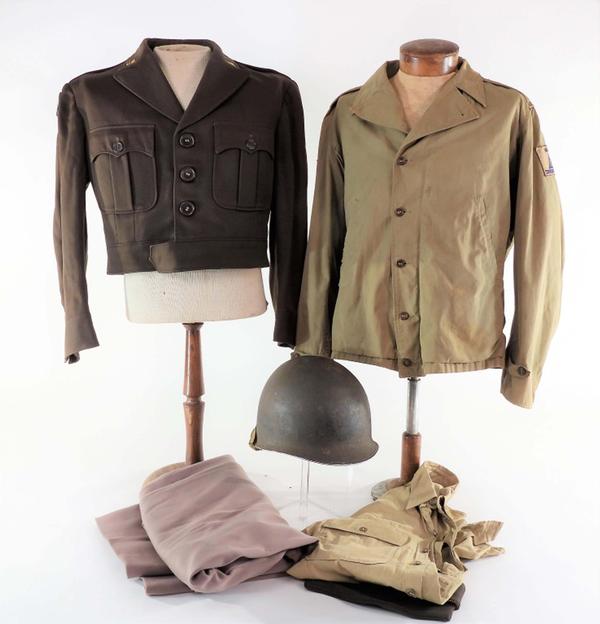 World War II U.S.  correspondent’s group with a fixed bale M1 helmet, a Model 41 field jacket with patches on both sleeves, “Ike” jacket with patches, shirt, trousers, side cap (est.  $400-$600).