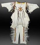 This early 1900s hand-crafted white buckskin Mandan war shirt with matching leggings should realize $4,000-$8,000.