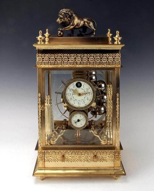 Rare 19th century French rolling ball waterwheel clock, almost identical to one in Palace Museum in the Forbidden City in Beijing, housed in a gilded bronze case (est.  $3,000-$5,000).  