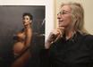 Annie Leibovitz with her famous Vanity Fair magazine cover of a nude and pregnant Demi Moore.