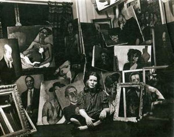 Alice Neel with paintings in her apartment, 1940.  Photo: Sam Brody.  © Estate of Alice Neel