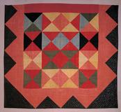 HARLEQUIN MEDALLION QUILT, Artist unidentified, New England, 1800-1820.  Glazed wool 87 x 96".  American Folk Art Museum, New York, gift of Cyril Irwin Nelson in loving memory of his grandparents John Williams and Sophie Anna Macy, 1984.33.1.  