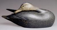 Painted black duck decoy made around 1903 by A. Elmer Crowell of East Harwich, Mass., for his friend and employer Dr John C. Phillips sold privately on Sunday for $103,500 after passing in the room on Saturday