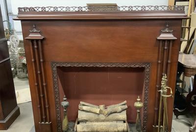 This RCA Victor fireplace radio ($500-1,500) comes with a set of fireplace tools and accessories.  It measures 50 by 60 by 25 inches.