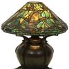 A rare Tiffany Studios leaded glass aquatic fish lamp ($80/100,000) on a bronze pumpkin base has a shade surrounded by five swimming fish in gold mottled glass, 17½ inches tall with a 16- inch diameter shade.