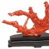 This Chinese red coral sculpture depicting Guan Yin figures sold for $66,550.