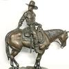 Bronze depiction of a cowboy on horseback by California sculptor Betty Saletta, titled Yesterday is Tomorrow, dated 1990, 31 inches tall ($5,000).