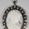 A stunning Russian Agate Cameo with 18kt yellow gold, diamond and pearl frame and dramatic black and white enamel.