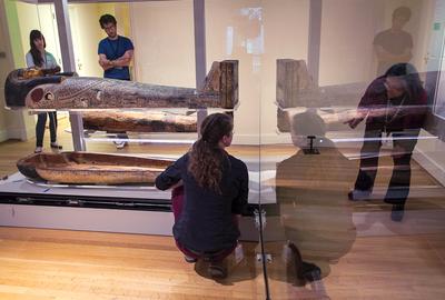 The mummy and coffin of ancient Egyptian priest Nesmin (250 BCE) are moved into a new, state-of-the-art, climate-controlled case in the RISD Museum's newly renovated galleries for ancient Egyptian art.  Tiered mountings and LED lights allow visitors to more effectively view the mummy, the coffin’s exterior, and beautiful but previously hidden interior paintings.