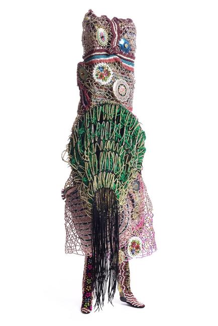 Nick Cave, Soundsuit, 2015.  Mixed media, including enameled can lids, macramé, shoelaces, plastic beads, metal, and mannequin, 99 x 37 x 36 in.  (251.5 x 94 x 91.4 cm).  Courtesy of the artist and Jack Shainman Gallery, New York.