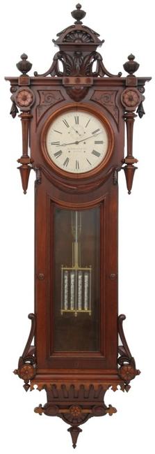 This E.  Howard & Co.  No.  49 hanging regulator ($100/150,000) has its original 14-inch painted metal dial signed “E.  Howard & Co., Boston,” brass, signed 8-day weight driven time only movement, 104 inches tall.