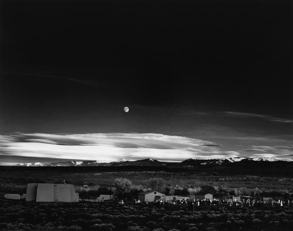 Lot 103: Ansel Adams, Moonrise, Hernandez, New Mexico, silver print, 1941, printed circa 1965.  Estimate $80,000 to $120,000.