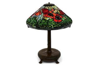 The top lot of the sale overall was this Tiffany Studios “Poppy” table lamp, circa 1905, with vibrant red poppies surrounded by blue and yellow background glass, which attained $93,750.