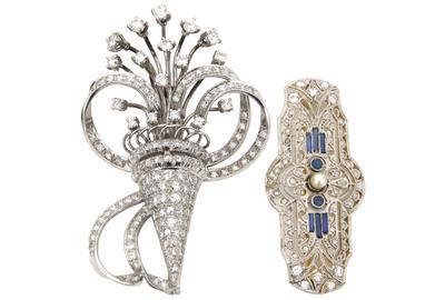 These two platinum, gold and diamond brooches ($1/1,500) will cross the block.