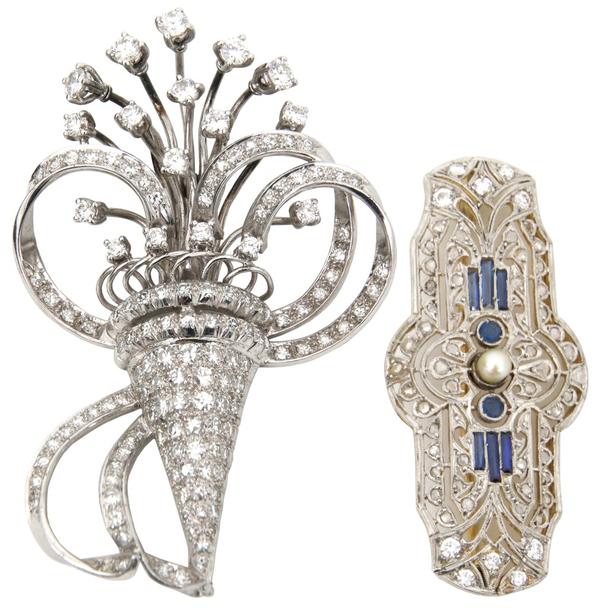 These two platinum, gold and diamond brooches ($1/1,500) will cross the block.