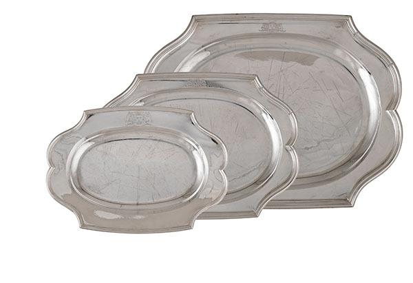 Three Earl of Warrington Silver Serving Platters, Dunham Massey.  Estimate: $20,000-$30,000.  