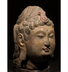 China, Tang Dynasty gilded stone head of Buddha with two-tiered ‘snail-shell’ hair curls ornamented by red spiraling ‘jewel,’ circa 618-907 A.D., 530mm tall on custom stand.  Provenance: Old Somerset (England) collection of Asian art formed in 1980s/1990s.  Estimate £20,000-£40,000