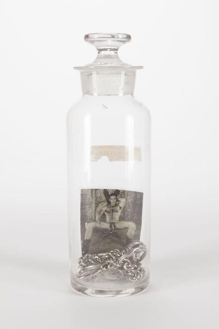 Boys in a Bottle: Poison, Assemblage with found objects and photograph, 8 3/8 x 3 x 3 inches.