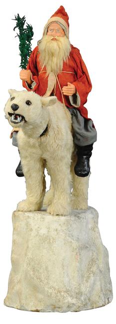 German cloth-dressed composition Santa on nodding glass-eyed polar bear atop ‘iceberg,’ 29in tall.  Sold for $36,000