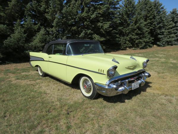 1957 Chevrolet Bel Air Convertible, an AACA Junior and Senior Award winner, a frame off restoration, great-looking yellow with black convertible top and beautiful stainless and trim.