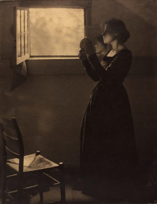 Clarence H.  White, American, 1871–1925, Girl with Mirror, 1912, printed after 1917.  Varnished palladium print.  George Eastman Museum, purchase.  